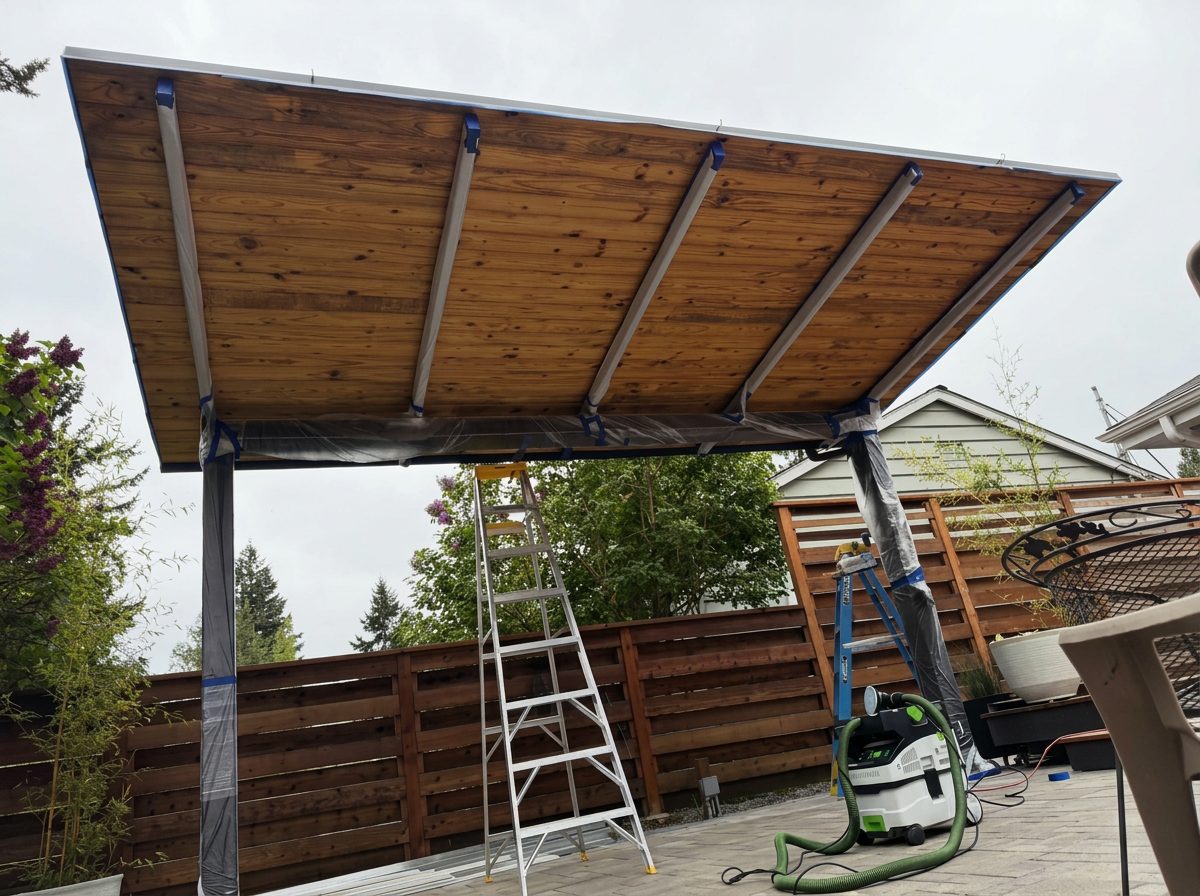 Weathered patio cover ceiling in Lake Forest Park before restoration